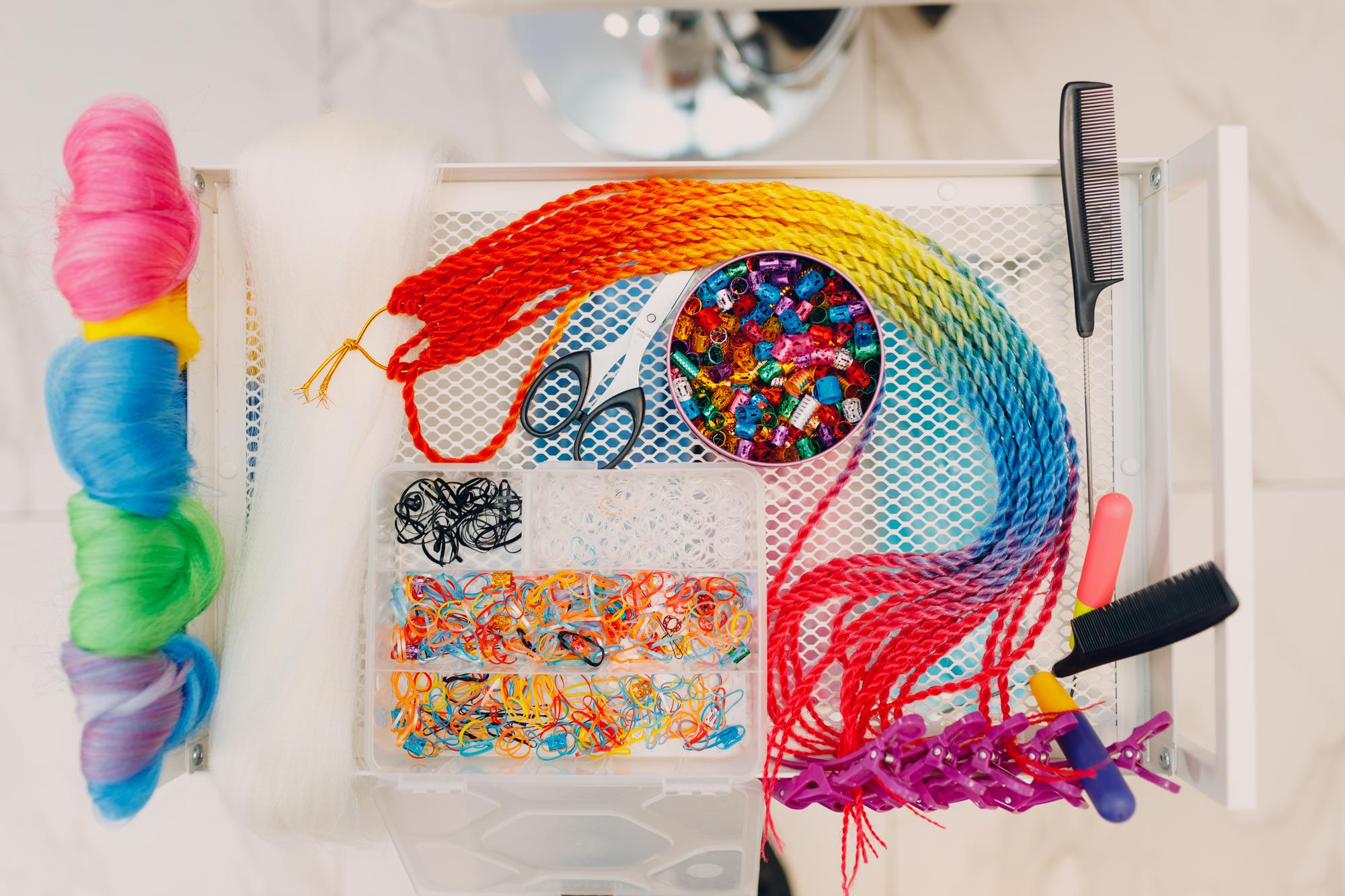 Stack of printed embroidery patterns and USB